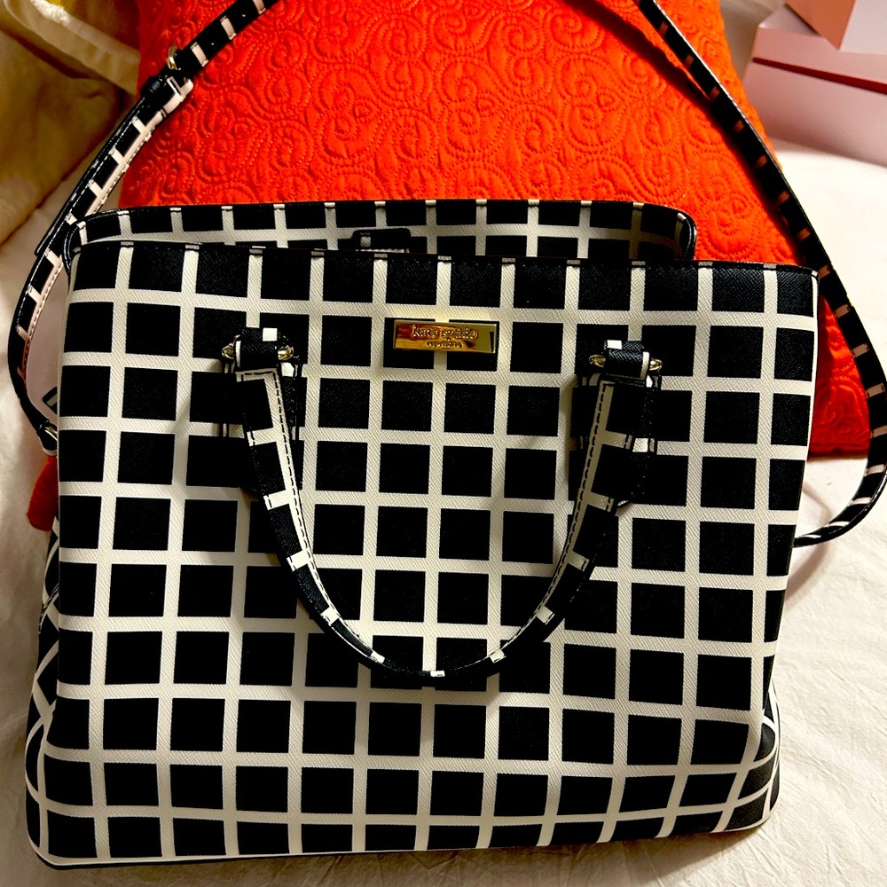 I will include a free wallet. Beautiful black-white retired Kate Spade purse.